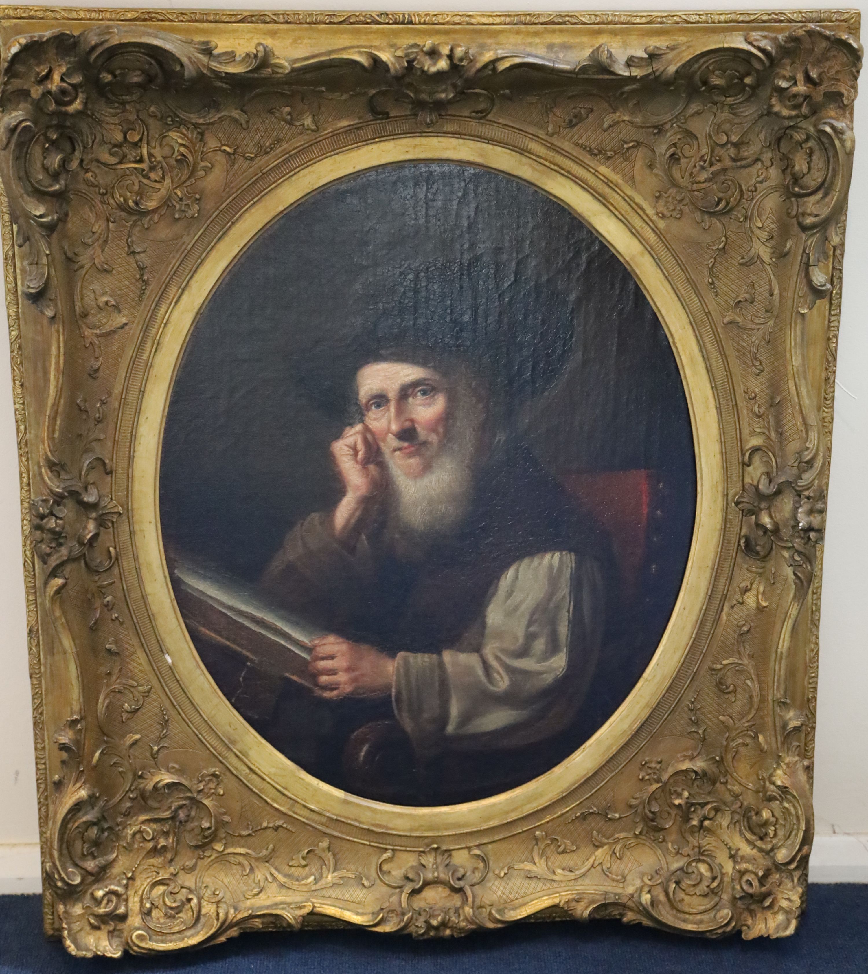 19th century Flemish School , Portrait of a 17th century gentleman seated reading a book, oil on canvas, 56 x 45.75cm., framed to the oval